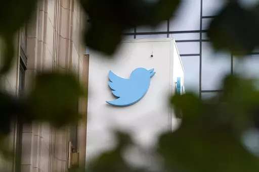 A sign at Twitter headquarters is shown in San Francisco, Thursday, Dec. 8, 2022. Twitter has suspended an account that used publicly available flight data to track Elon Musk's private jet, despite a pledge by the social media platform's new owner to keep it up because of his free speech principles. (AP Photo/Jeff Chiu, File)