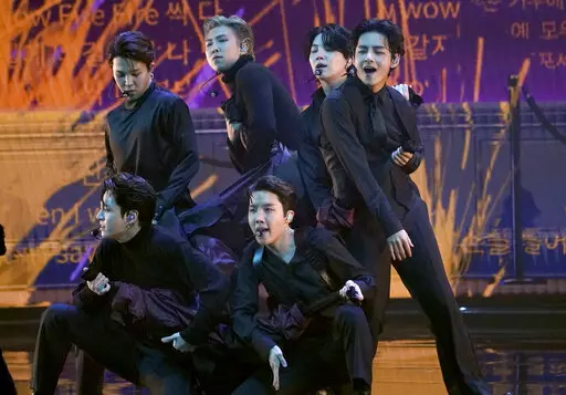BTS performs "Butter" at the 64th Annual Grammy Awards on April 3, 2022, in Las Vegas. The surprise announcement by BTS that they were taking a break to focus on members’ solo projects stunned their global fanbase, shaking their label's stock price and leaving many questions about the K-pop supergroup’s future. (AP Photo/Chris Pizzello, File)