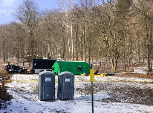 FBI agents and representatives of the Pennsylvania Department of Conservation and Natural Resources set up a base in March, 2018, in Benezette Township, Elk County, Pa. A scientific report commissioned by the FBI shortly before agents went digging for buried treasure suggested that a huge quantity of gold was below the surface, according to newly released government documents. (Katie Weidenboerner/The Courier-Express via AP, File)