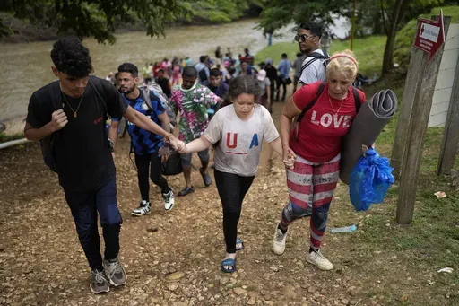 Migrants arrive to Lajas Blancas, Panama, after trekking across the Darien Gap from Colombia in hopes of reaching the U.S., Thursday, Sept. 26, 2024. (AP Photo/Matias Delacroix)