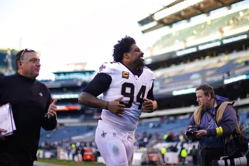 New Orleans Saints defensive end Cameron Jordan (94) runs off the field after an NFL football game against the Philadelphia Eagles in Philadelphia, Sunday, Jan. 1, 2023. The Saints won 20-10. (AP Photo/Matt Rourke)