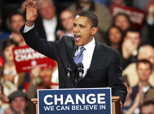 Democratic presidential hopeful, Sen. Barack Obama D-Ill., celebrates with his supporters after his victory in the Iowa caucus Jan. 3, 2008, in Des Moines, Iowa. (AP Photo/Rick Bowmer, File)