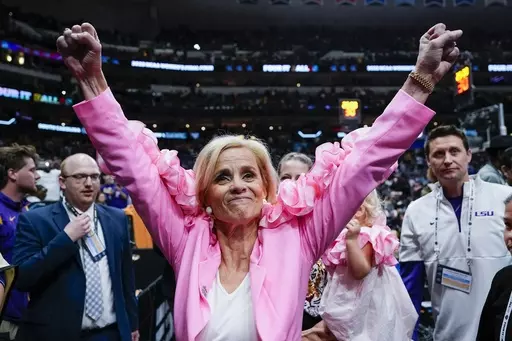 LSU head coach Kim Mulkey celebrates after an NCAA college Women's Final Four semifinal basketball game against Virginia Tech, Friday, March 31, 2023, in Dallas. Coming off the school's first NCAA women's basketball championship, LSU is ranked No. 1 in the AP Top 25 preseason women's basketball poll, released Tuesday, Oct. 17, 2023. (AP Photo/Darron Cummings, File)