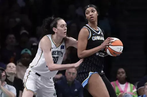 New York Liberty's Breanna Stewart (30) defends against Chicago Sky's Angel Reese (5) during the first half of a WNBA basketball game Thursday, May 23, 2024, in New York. (AP Photo/Frank Franklin II)