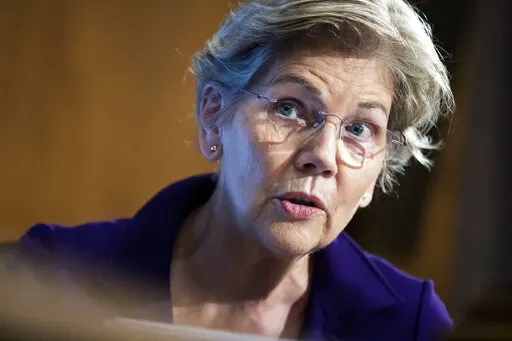 Sen. Elizabeth Warren, D-Mass., speaks during a Senate Banking Committee hearing, March 3, 2022 on Capitol Hill in Washington. Sen. Warren is slamming Rep. Kevin McCarthy as a “liar and a traitor” over recordings that show the House Republican leader — despite his denials — placing responsibility on former President Donald Trump for the Jan. 6 insurrection and saying he should resign. McCarthy initially had denied a New York Times report last week that detailed his phone conversations wi