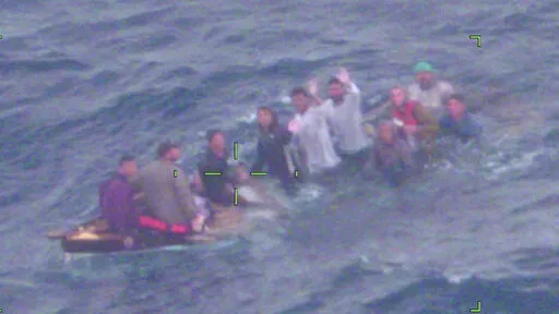 This image made available by the the U.S. Coast Guard shows Cuban migrants on a sinking vessel spotted on Thursday, Feb. 3, 2022, about 40 miles off Key Largo, Fla. “They didn’t have lifejackets or safety equipment,” said Capt. Shawn Koch, commanding officer of Air Station Miami. “If the air crew hadn’t found them on the patrol, these people would not have survived the night.”  The migrants were repatriated to Cuba, the Coast Guard said. (U.S. Coast Guard via AP)