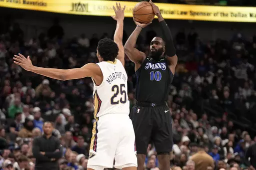 Dallas Mavericks forward Tim Hardaway Jr. (10) looks to shoot as New Orleans Pelicans guard Trey Murphy III (25) defends in the second half of an NBA basketball game in Dallas, Monday, Jan. 15, 2024. (AP Photo/Tony Gutierrez)