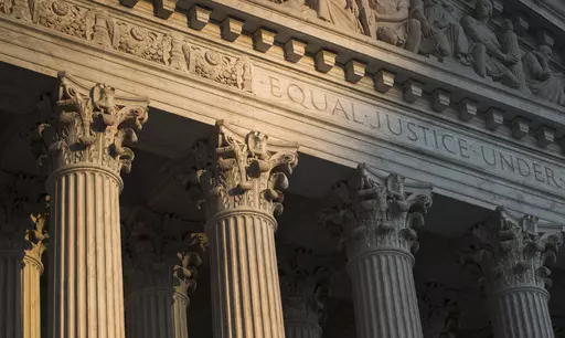 The Supreme Court in Washington is seen at sunset on Oct. 10, 2017. In a monthslong inquiry, which included reviewing tens of thousands of pages of documents from more than 100 public records requests, The Associated Press has examined what happens behind the scenes when Supreme Court justices travel to colleges and universities for lectures and other events. The AP learned the identities of donors and politicians invited to events with justices, details about the perks that have accompanied the