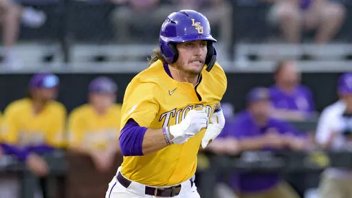 LSU outfielder Dylan Crews runs against Kennesaw St. during an NCAA regional baseball game on June 3, 2022, in Hattiesburg, Miss. Crews was LSU’s first SEC player of the year since 2012 after batting .349 with 22 homers and 72 RBIs. (AP Photo/Matthew Hinton, File)