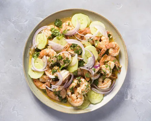This image released by Milk Street shows a recipe for drunken shrimp with tequila (Camarones Borrachos). (Milk Street via AP)