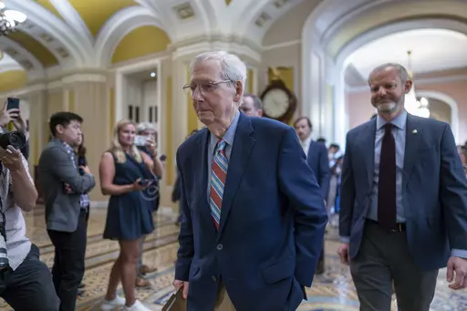 Senate Minority Leader Mitch McConnell, R-Ky., enters the chamber as he returns to work at the Capitol in Washington, Tuesday, Sept. 5, 2023. Questions have mounted over the long-serving Republican leader's health since McConnell froze up last week during a press conference in Kentucky, unable to respond to a question. It was the second such episode in a matter of weeks. (AP Photo/J. Scott Applewhite)