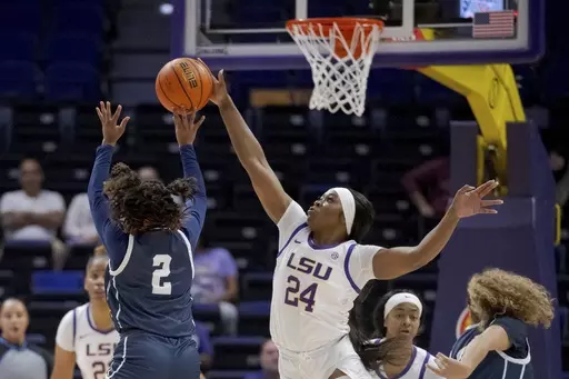 LSU guard Aneesah Morrow (24) blocks the shot of East Texas Baptist guard Kadia Ward (2) during the first half of an NCAA college basketball exhibition game Thursday, Oct. 26, 2023, in Baton Rouge, La. (AP Photo/Matthew Hinton)