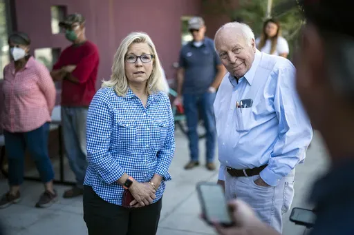 Rep. Liz Cheney, R-Wyo., arrives, with her father, former Vice President Dick Cheney, to vote at the Teton County Library during the Republican primary election Aug. 16, 2022, in Jackson Hole, Wyo. (Jabin Botsford/The Washington Post via AP, File)
