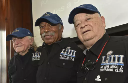 Members of the Never Miss a Super Bowl Club, from the left, Tom Henschel, Gregory Eaton, and Don Crisman pose for a group photograph during a welcome luncheon, in Atlanta, Friday, Feb. 1, 2019. As long as they still have each other, they're still going to go to every Super Bowl. That's the sentiment shared by the three friends who say they are the final fans who can claim membership in the exclusive “never missed a Super Bowl” club. And they're back again for number 58 — Super Bowl 58 — 