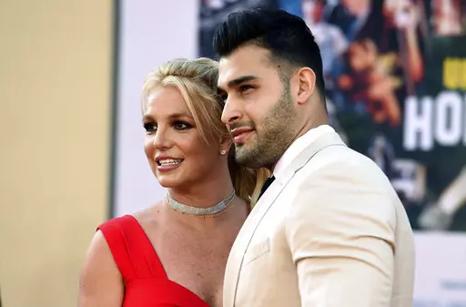 Britney Spears and Sam Asghari arrive at the Los Angeles premiere of "Once Upon a Time in Hollywood," at the TCL Chinese Theatre, Monday, July 22, 2019. Spears and her partner Asghari announced in a joint post on Instagram, Saturday, May 14, 2022, that they had lost their baby during pregnancy. The announcement came a little over a month after the couple revealed they were expecting a child. (Photo by Jordan Strauss/Invision/AP, File)