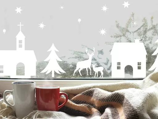 This image provided by Tempaper shows stick on festive decoration on a window. Tempaper's Christmas Village peel-and-stick decals can be put on a wall or window; great if you've got hardly anywhere to decorate for the holidays. This charming Festival of Lights decal from Tempaper can be placed anywhere; it peels right off when the season is over. (Tempaper via AP)