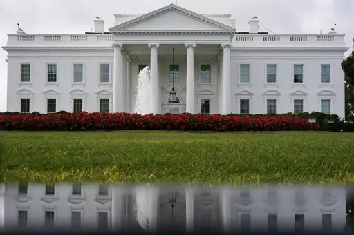 The White House is seen reflected in a puddle, Saturday, Sept. 3, 2022, in Washington. With roughly a year and a half until the 2024 presidential contest, the field of candidates is largely set. Former President Donald Trump and Florida Gov. Ron DeSantis have dominated the early Republican race, but other candidates including former Vice President Mike Pence, former United Nations Ambassador Nikki Haley and U.S. Sen. Tim Scott of South Carolina are looking for an opening in case either falters. 
