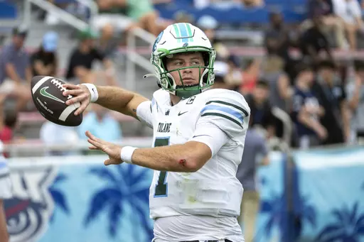 Tulane quarterback Michael Pratt (7) throws the ball as he warms up during the first half of an NCAA football game against Florida Atlantic on Saturday, Nov. 18, 2023 in Boca Raton, Fla. (AP Photo/Doug Murray)