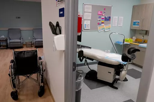 An unoccupied recovery area, left, and an abortion procedure room are seen at a Planned Parenthood Arizona facility in Tempe, Ariz., on June 30, 2022. On Friday, Dec. 30, 2022, the Arizona Court of Appeals concluded that abortion doctors can't be prosecuted under a pre-statehood law that criminalizes nearly all abortions. The law had been blocked from being enforced shortly after the U.S. Supreme Court issued its 1973 Roe v. Wade decision. But after the Supreme Court overturned the landmark deci