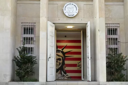 The entrance to the former U.S. Embassy, which has been turned into an anti-American museum, is seen in Tehran, Iran, on Saturday, Aug. 19, 2023. U.S. porn actor Whitney Wright, who has advocated for Palestinians online during Israel's war on Hamas, traveled to Iran in Feb. 2024 and visited the former U.S. Embassy in Tehran abandoned after the 1979 hostage crisis. The visit by Wright has sparked heated criticism over the country's crackdown on women since the 2022 death in police custody of Mahs