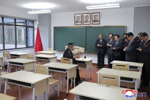 In this photo provided by the North Korean government, North Korean leader Kim Jong Un, left, inspects a class room of a newly built central cadres training school in Pyongyang, North Korea, Tuesday, May 21, 2024. Independent journalists were not given access to cover the event depicted in this image distributed by the North Korean government. The content of this image is as provided and cannot be independently verified. Korean language watermark on image as provided by source reads: "KCNA" whic