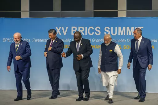 FILE- From left, Brazil's President Luiz Inacio Lula da Silva, China's President Xi Jinping, South Africa's President Cyril Ramaphosa, India's Prime Minister Narendra Modi and Russia's Foreign Minister Sergei Lavrov pose for a BRICS group photo during the 2023 BRICS Summit in Johannesburg, South Africa, Aug. 23, 2023. Modi says his country is “becoming the voice of the Global South,” and that at the upcoming Group of 20 meetings being held in New Delhi that voice will be heard. At the recent