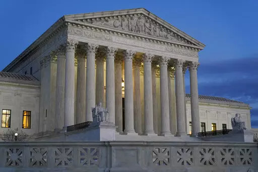 Light illuminates part of the Supreme Court building at dusk on Capitol Hill in Washington on Nov. 16, 2022. The chairman of the Senate Judiciary Committee said his panel is reviewing “serious allegations” in a report Saturday, Nov. 19, 2022, that a former anti-abortion leader knew in advance the outcome of a 2014 Supreme Court case involving health care coverage of contraception. (AP Photo/Patrick Semansky, File)