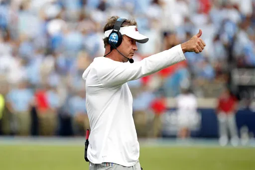 Mississippi head coach Lane Kiffin signals to players during the second half of an NCAA college football game against the Mississippi, Saturday, Oct. 26, 2024, in Oxford, Miss. (AP Photo/Sarah Warnock)