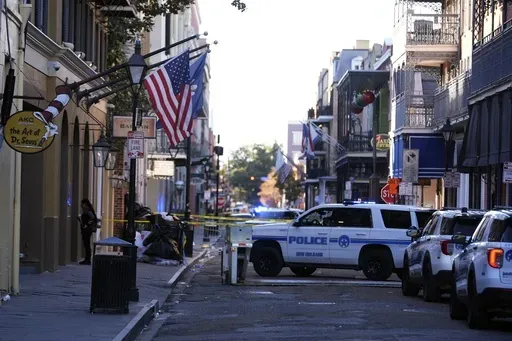 Emergency service vehicles form a security barrier to keep other vehicles out of the French Quarter after a vehicle drove into a crowd on New Orleans' Canal and Bourbon Street, Wednesday Jan. 1, 2025. (AP Photo/Gerald Herbert, File)