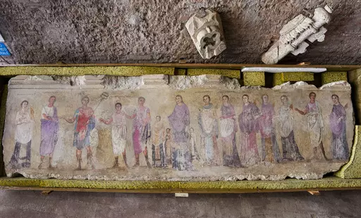 An undated fragment of a wall painting depicting deities and feminine figures and part of 750 archaeological finds from clandestine excavations on Italian territory is on display during a press conference in Rome, Wednesday, May 31, 2023. The set of artifacts, which can be dated overall between the eighth century BC. and the medieval period, and whose value is estimated at 12 million euros, was in possession of an English company in liquidation, Symes Ltd, attributable to Robin Symes, an importa