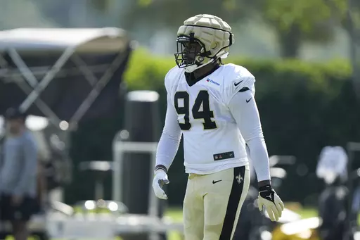 New Orleans Saints defensive end Cameron Jordan (94) walks between drills at the NFL team's football training camp in Metairie, La., Tuesday, Aug. 1, 2023. (AP Photo/Gerald Herbert)