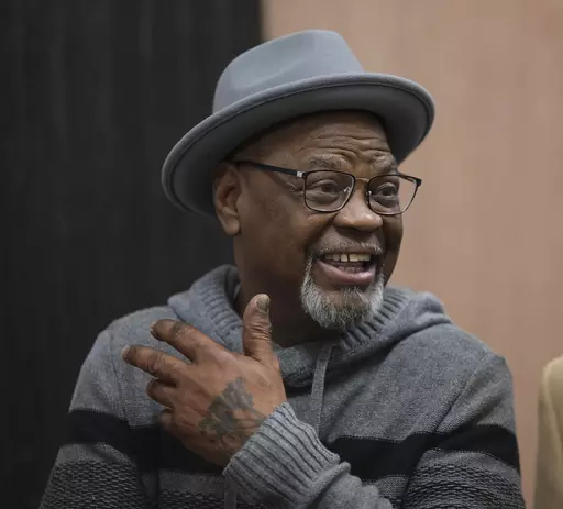 Glynn Simmons reacts after stepping out of the courthouse after Judge Amy Palumbo ruled to approve his "actual innocence" claim during a hearing at the Oklahoma County Courthouse Tuesday, Dec. 19, 2023, in Oklahoma City, Okla. (Doug Hoke/The Oklahoman via AP)