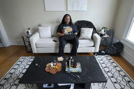 Odia Kaba works from home in Ypsilanti, Mich., Tuesday, May 23, 2023. Growing up in Ann Arbor, there was an expectation that Odia would attend the University of Michigan. When her application was deferred, she started at Eastern Michigan with plans to transfer to Ann Arbor her sophomore year. But she was getting daily texts from her sister, who attended U-M, describing the microaggressions she faced as a Black student on campus. Kaba stayed at Eastern Michigan and graduated with a degree in quan