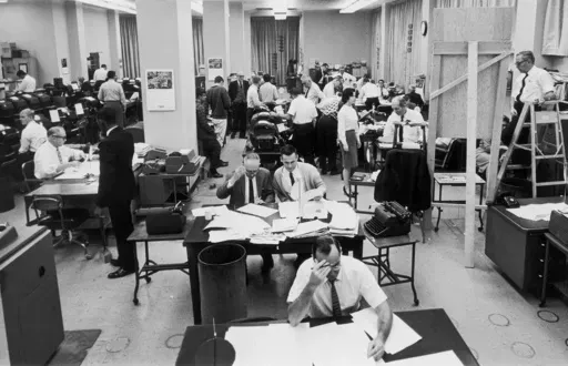 Staffers work on election night at the Washington bureau of The Associated Press on Nov. 3, 1964. (AP Photo, File)