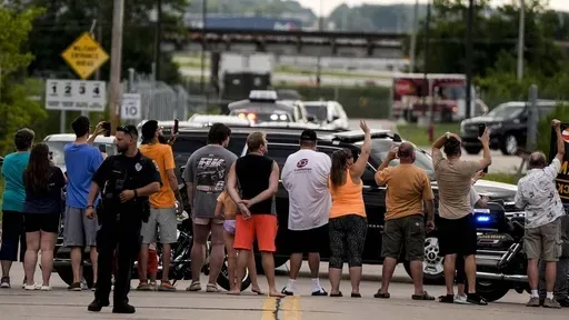 Supporters wave to former President Donald Trump as he arrives to the Milwaukee Mitchell International Airport ahead of the 2024 Republican National Convention, Sunday, July 14, 2024, in Milwaukee. (AP Photo/Mike Stewart)