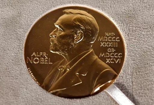 A Tuesday, Dec. 8, 2020 file photo of a Nobel medal displayed during a ceremony in New York. (Angela Weiss/Pool Photo via AP, File)