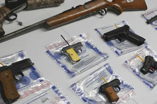 A collection of illegal guns is displayed during a gun buyback event, Saturday May 22, 2021 in the Brooklyn borough of New York. Individuals received pre-paid card payments of $25 up to $250 for firearms - with a bonus iPad for certain handguns or assault rifles, at the no-questions-asked event, co-sponsored by state and county attorney generals and the NYPD. According to a study published by JAMA Network Open on Tuesday, Nov. 29, 2022, the U.S. gun death rate in 2021 hit its highest mark in nea