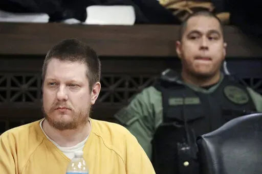Chicago police Officer Jason Van Dyke, left, attends his sentencing hearing at the Leighton Criminal Court Building in Chicago, for the 2014 shooting of Laquan McDonald, Jan. 18, 2019. Federal authorities say they will not criminally charge Van Dyke, convicted of murder in the 2014 shooting death of McDonald. In a news release Monday, April 18, 2022, the U.S. Attorney's Office in Chicago said the decision was made after consulting with the McDonald family. (Antonio Perez/Chicago Tribune via AP, 