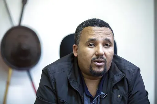 Opposition politician Jawar Mohammed speaks during an interview with The Associated Press at his house in Addis Ababa, Ethiopia on Oct. 24, 2019. Ethiopia's government on Friday, Jan. 7, 2022 announced an amnesty for some of the country's most high-profile political detainees, including opposition figure Jawar Mohammed and senior Tigray party officials, as Prime Minister Abiy Ahmed spoke of reconciliation for Orthodox Christmas. (AP Photo/Mulugeta Ayene, File)
