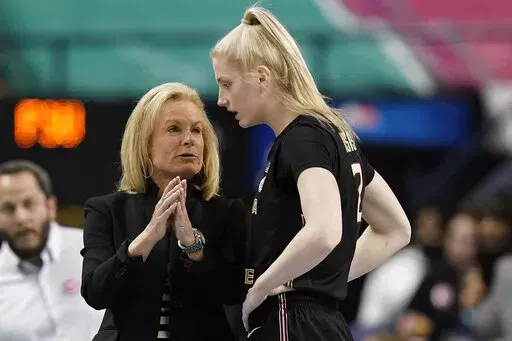 Florida State head coach Sue Semrau speaks with guard Sammie Puisis (2) during the first half of an NCAA college basketball quarterfinal game against North Carolina State at the Atlantic Coast Conference women's tournament in Greensboro, N.C., Friday, March 4, 2022. (AP Photo/Gerry Broome)