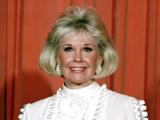 Actor and animal rights activist Doris Day poses for photos after receiving the Cecil B. DeMille Award she was presented with at the annual Golden Globe Awards ceremony in Los Angeles on Jan. 28, 1989. The 100th anniversary of Doris Day’s birthday is being by with a social-media fundraiser honoring her passion for animals. The Doris Day Animal Foundation is asking people to donate to the foundation to help support animal welfare programs nationwide. Day died May 13, 2019, at age 97. (AP Photo,