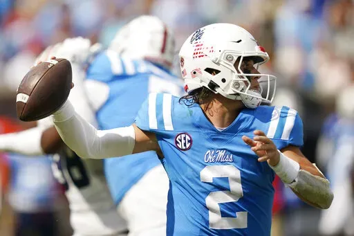 Mississippi quarterback Jaxson Dart (2) sets up to pass against Auburn during the second half of an NCAA college football game in Oxford, Miss., Saturday, Oct. 15, 2022. Mississippi won 48-34. (AP Photo/Rogelio V. Solis)