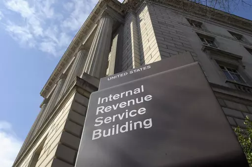The exterior of the Internal Revenue Service (IRS) building is seen in Washington, on March 22, 2013. Congress is racing to wind down a tax break meant to encourage businesses to keep workers on the payroll during the COVID-19 pandemic. What was expected to cost the government $55 billion has instead cost it nearly five times that amount as of July. Meanwhile, new claims pour into the IRS each week. (AP Photo/Susan Walsh, File)
