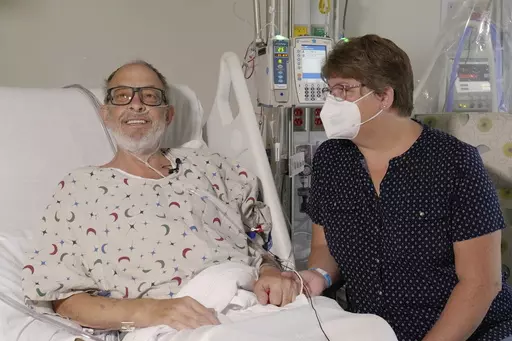 In this photo provided by the University of Maryland School of Medicine, Lawrence Faucette sits with wife, Ann, in the school's hospital in Baltimore, Md., in September 2023, before receiving a pig heart transplant. Lawrence Faucette, the second person to receive a transplanted heart from a pig has died, nearly six weeks after the highly experimental surgery, his doctors announced Tuesday, Oct. 31, 2023. (Mark Teske/University of Maryland School of Medicine via AP, File)
