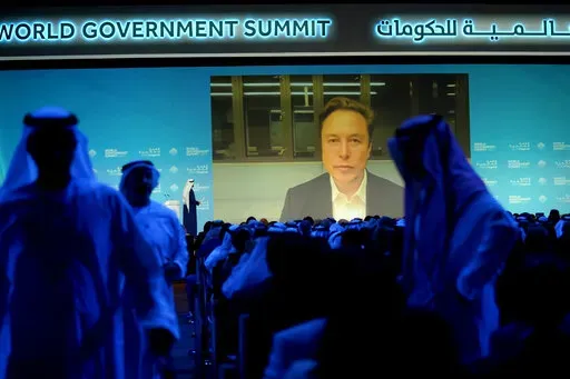Elon Musk talks virtually to UAE Minister of Cabinet Affairs Mohammad Al Gergawi during the World Government Summit in Dubai, United Arab Emirates, Wednesday, Feb 15, 2023. (AP Photo/Kamran Jebreili)