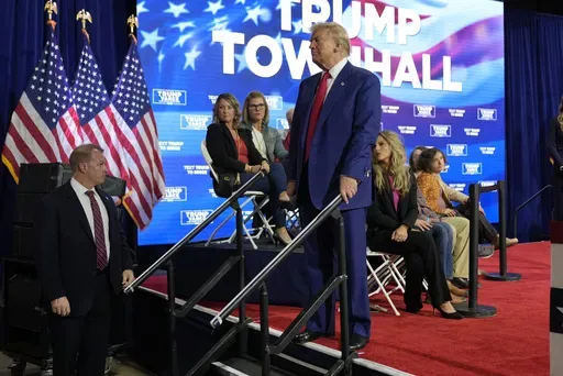 Republican presidential nominee former President Donald Trump checks on a person having a medical emergency at a campaign town hall at the Greater Philadelphia Expo Center & Fairgrounds, Monday, Oct. 14, 2024, in Oaks, Pa. (AP Photo/Alex Brandon)