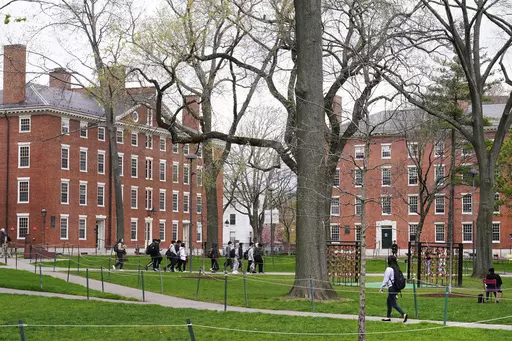 Students walk through Harvard Yard, April 27, 2022, on the campus of Harvard University in Cambridge, Mass. On Monday, July 24, 2023, the U.S. Department of Education opened an investigation into Harvard University's policies on legacy admissions, which give an edge to applicants with family ties to alumni. (AP Photo/Charles Krupa, File)