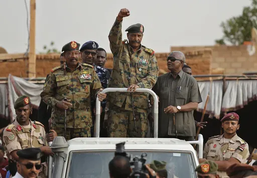 Sudanese Gen. Abdel-Fattah Burhan, head of the military council, waves to his supporters upon his arrival to attend a military-backed rally, in Omdurman district, west of Khartoum, Sudan, Saturday, June 29, 2019.(AP Photo/Hussein Malla, File)