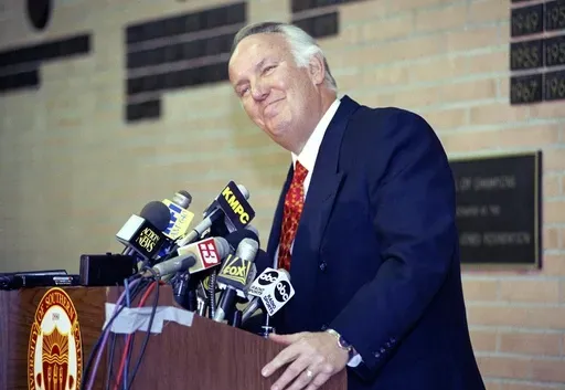 Former head coach of the Los Angeles Rams John Robinson addresses the media in Los Angeles, Jan. 3, 1992. (AP Photo/Chris Martinez, File)