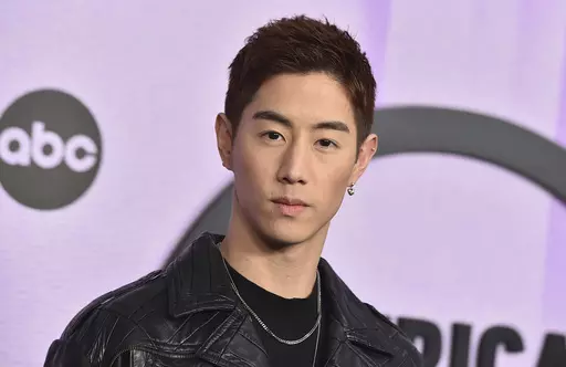 K-pop musician Mark Tuan arrives at the American Music Awards in Los Angeles on Nov. 20, 2022. On Friday, he released “Fallin,” following his 2022 debut solo album, “The Other Side.” (Photo by Jordan Strauss/Invision/AP, File)